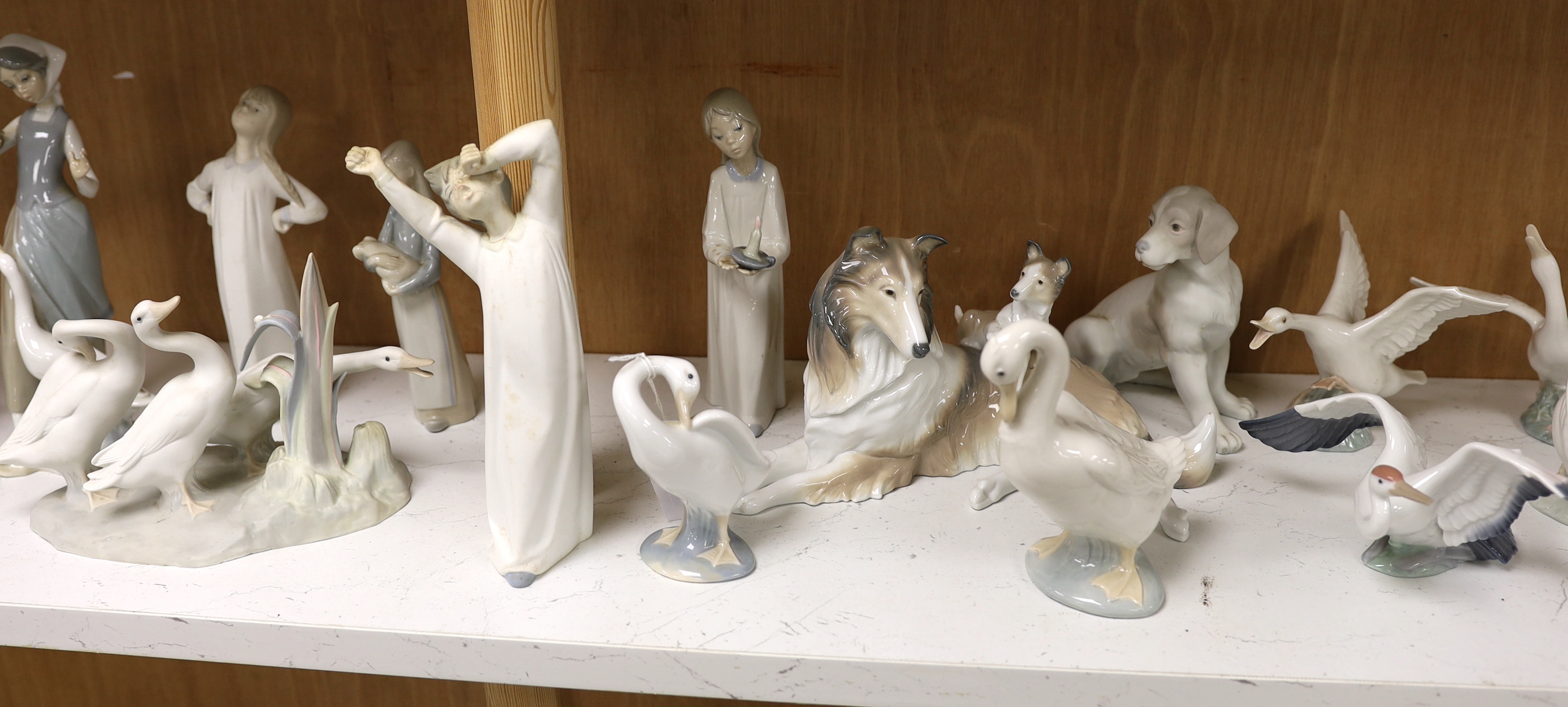 Twenty pieces of Lladro and Nao porcelain, tallest 31cm